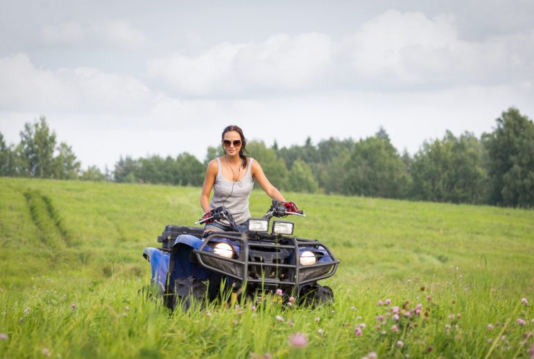 Elegant woman riding quadrocycle