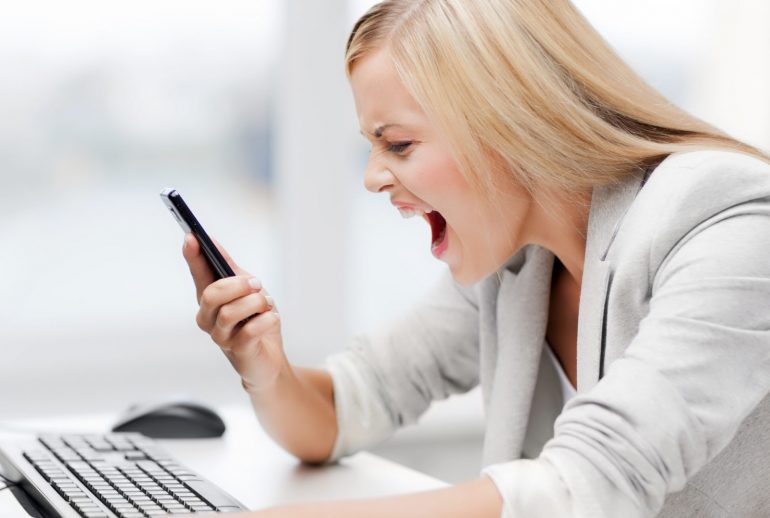 picture of angry woman shouting at phone