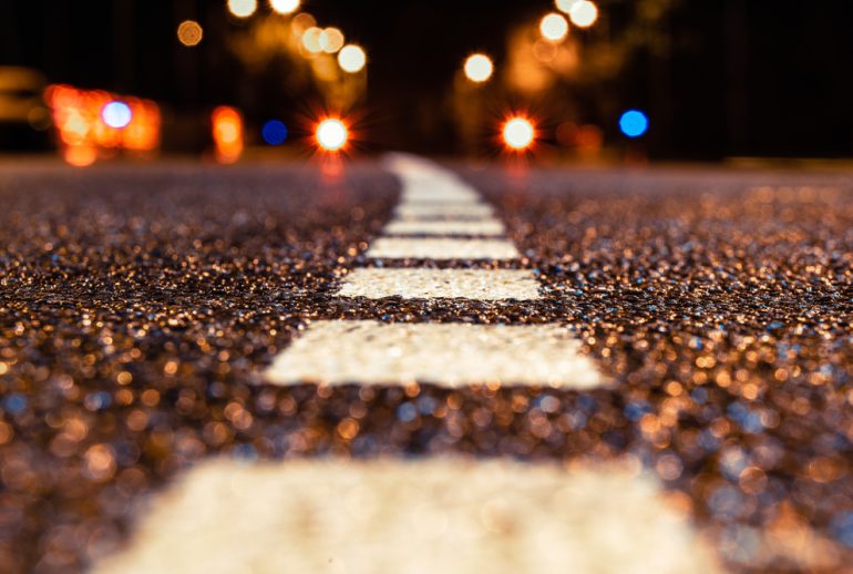Asphalt,Road,Leading,Into,The,City,At,Night.,Selective,Focus.