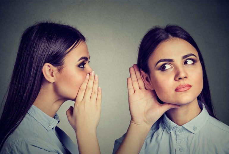 Latest,Rumors.,Woman,Whispering,In,The,Ear,To,Herself