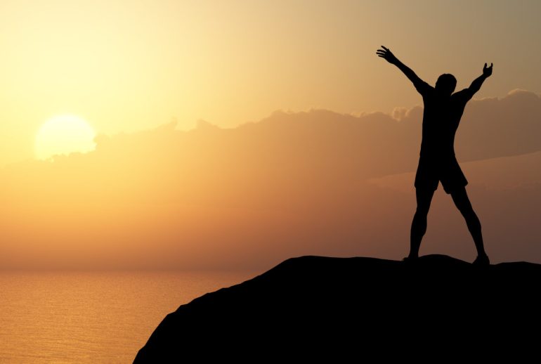 Men,Greeting,Sun.,Stands,On,Hill,,Ocean,And,Yellow,Sunset